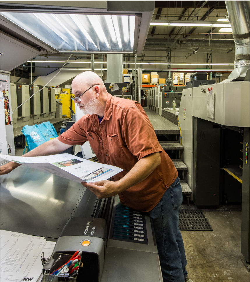 worker processing a printing order