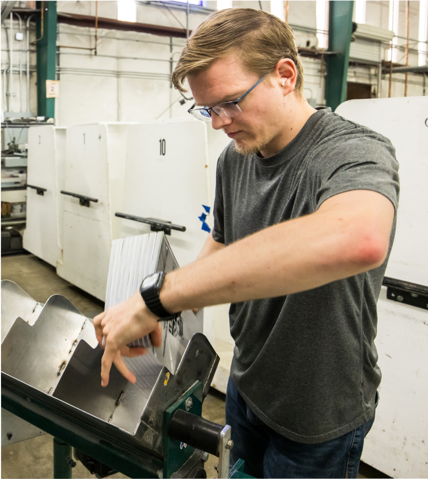 Worker in printing facility