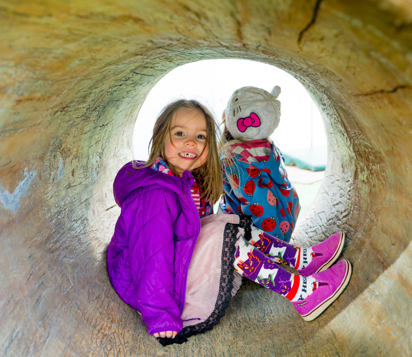 kid playing in tunnel